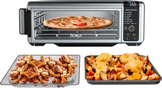Ninja Foodi oven with plates of food