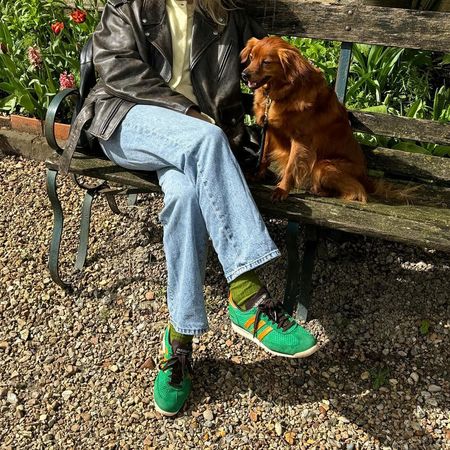 Lucy Williams wearing green Adidas SL72 RS sneakers