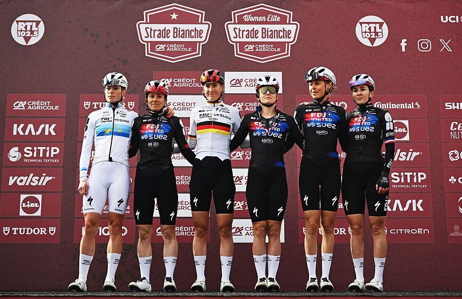 SIENA, ITALY - MARCH 07: Demi Vollering of Netherlands, Juliette Berthet of France, Elise Chabbey of Switzerland, Lea Curinier of France, Franziska Koch of Germany, Amber Kraak of Netherlands and Team FDJ United - SUEZ prior to the 12th Strade Bianche Donne 2026 a 133km one day race from Siena to Siena / #UCIWWT / on March 07, 2026 in Siena, Italy. (Photo by Luc Claessen/Getty Images)