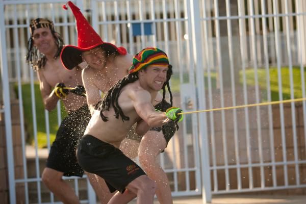 Scott Stewart, Ralf Medlaff and Danny Van Haute during a team-building tug-of-war at the hotel pool. Losers from the first round were forced to wear wigs.