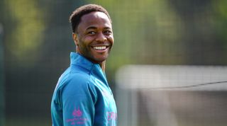 Manchester City forward Raheem Sterling, smiling