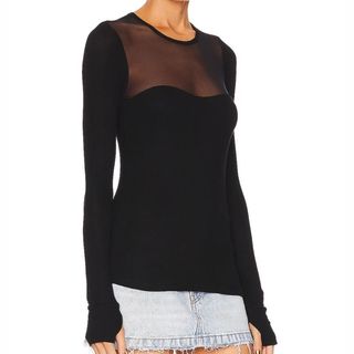 Flat lay image of woman wearing black top