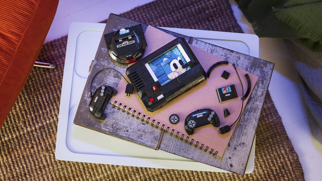 Lego Sega Genesis Console set in pieces on a notepad