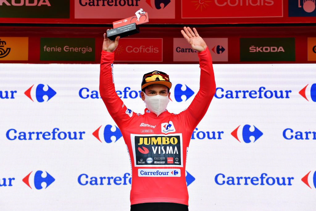 LEKUNBERRI SPAIN OCTOBER 21 Podium Primoz Roglic of Slovenia and Team Jumbo Visma Red Leader Jersey Celebration Trophy Mask Covid safety measures during the 75th Tour of Spain 2020 Stage 2 a 1516km stage from Pamplona to Lekunberri lavuelta LaVuelta20 La Vuelta on October 21 2020 in Lekunberri Spain Photo by Justin SetterfieldGetty Images