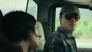 Kelsey Asbille as Iris sitting in a truck next to Finn Wittrock as "Richard" in Don't Move