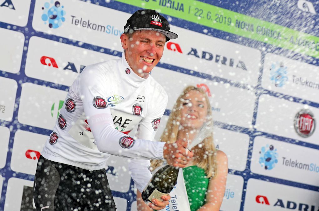 Tadej Pogacar celebrates in the white jersey after stage 2 in Slovenia