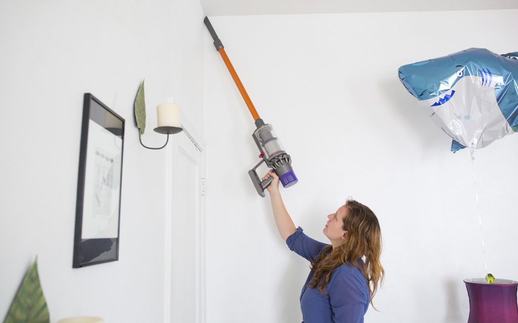The v10's extension wand can help you reach high into corners to clean cobwebs.