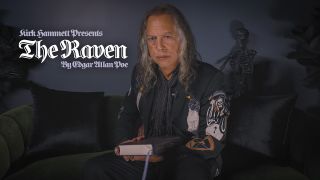 Kirk Hammett of Metallica holding a book
