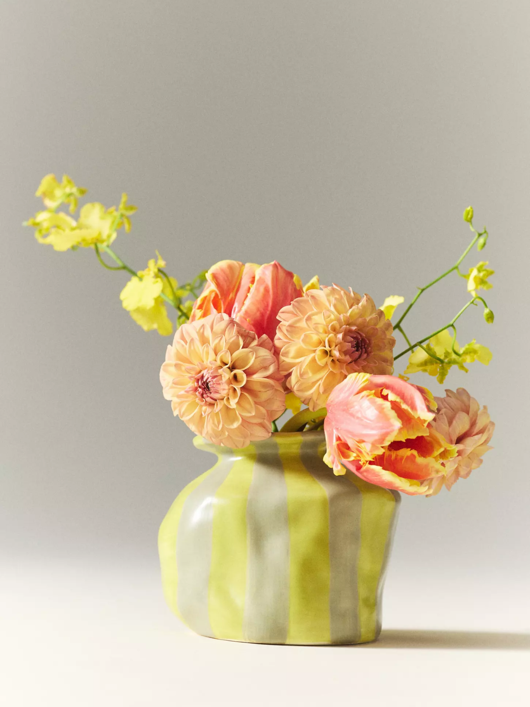 A striped textured ceramic striped yellow vase