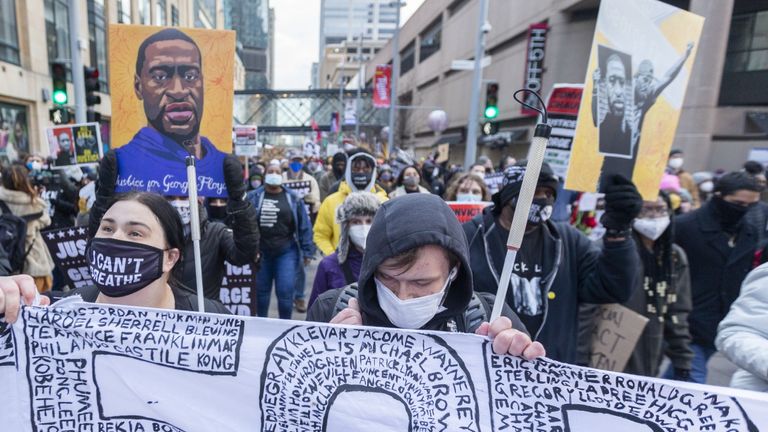 Protesters march through the city streets on the day of closing arguments in the trial of former officer Derek Chauvin over the killing of George Floyd in Minneapolis, United States on April 19, 2021.