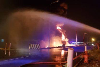 Firefighters fight a blaze caused by a Houthi strike in Jizan, Saudi Arabia