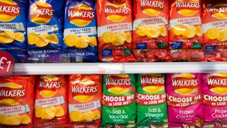 Walkers Crisps packets in an aisle