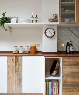 white and wood tone cabinetry and shelf in kitchen