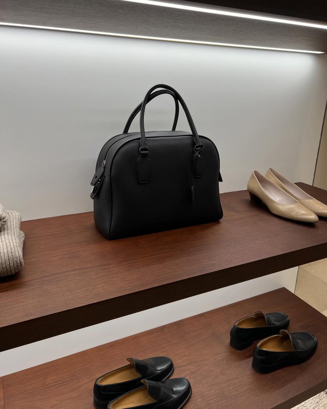 The Row India Bag on a shelf at The Row store in Paris