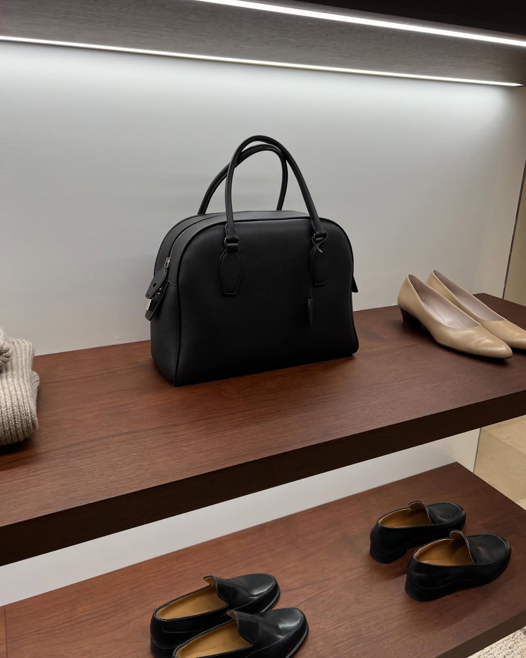 The Row India Bag on a shelf at The Row store in Paris