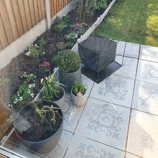 grey patio tiles with potted plants