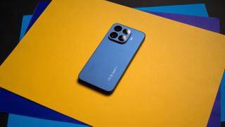 Xiaomi 17T Pro rear view against a colorful craft sheet highlighting the design