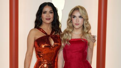 Salma Hayek stunned in a burnt orange, copper sequin gown