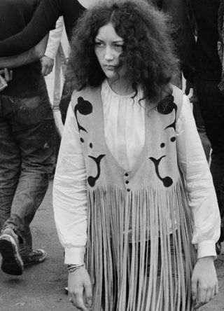 An audience member wearing a fringed buckskin jacket on the first day of the Woodstock Music Festival, Bethel, New York, 15th August 1969.