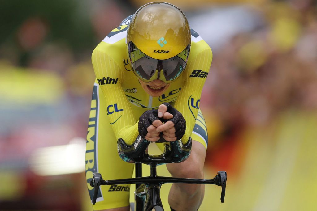 Jumbo-Visma's Danish rider Jonas Vingegaard wearing the overall leader's yellow jersey cycles to the finish line during the 16th stage of the 110th edition of the Tour de France cycling race, 22 km individual time trial between Passy and Combloux, in the French Alps, on July 18, 2023. (Photo by Thomas SAMSON / AFP)