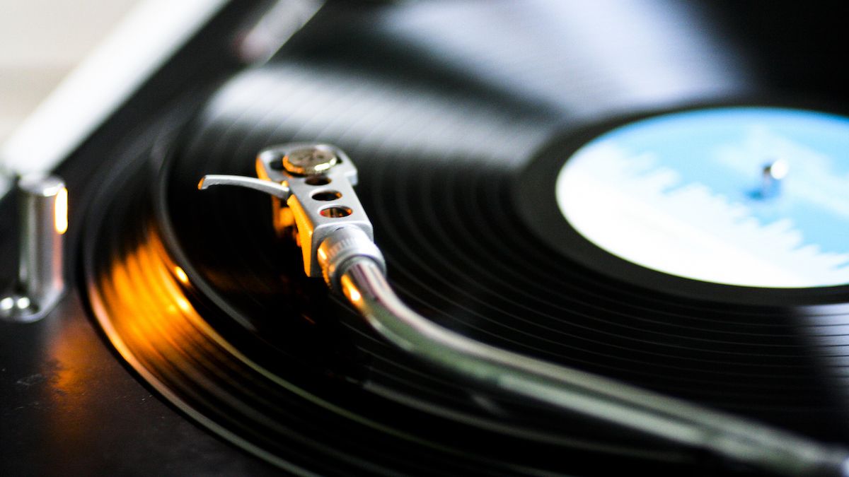 Close up of a tonearm over a vinyl record