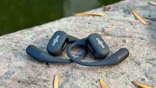 A close-up of the Shokz OpenFit sitting on top of one another