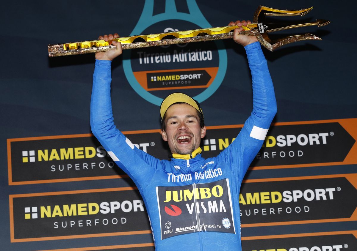 Primoz Roglic with the trident trophy