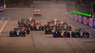 A pack of race cars are trailed by a single car in Formula 1 Drive to Survive season 4