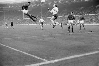 Portugal's Eusebio jumps for the ball with England’s Stiles during the World Cup semi-final at Wembley, which England won 2-1