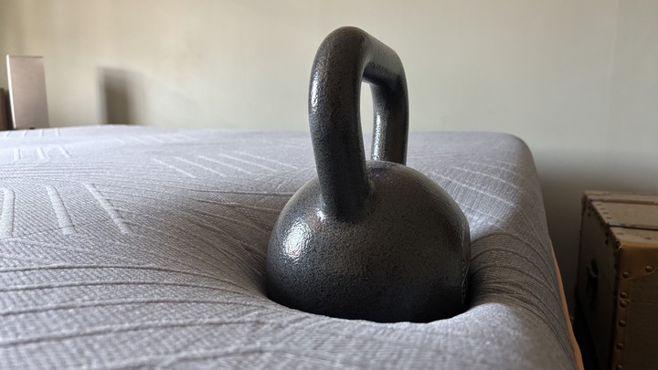 A large weight perched on the edge of the EGOHOME Black 12