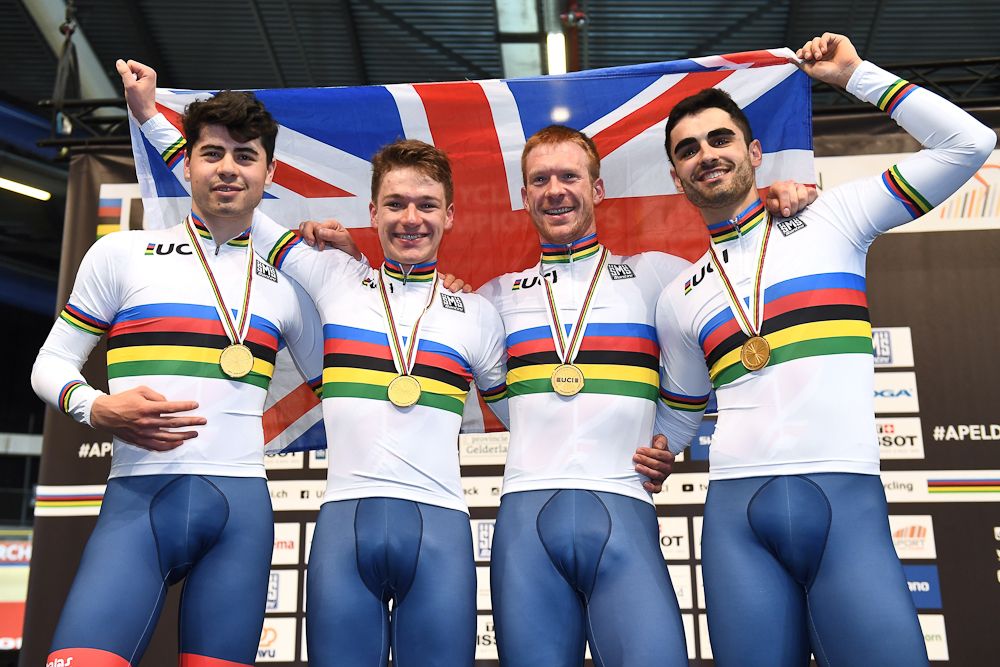 Great Britain's team members (L-R) Charlie Tanfield, Ethan Hayter, Edward Clancy and Kian Emadi pose on the podium after winning the men's Team Pursuit