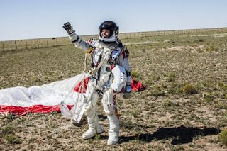 Pilot Felix Baumgartner of Austria celebrates after successfully completing the world's highest skydive, a supersonic leap, for Red Bull Stratos in Roswell, New Mexico, on Oct. 14, 2012.