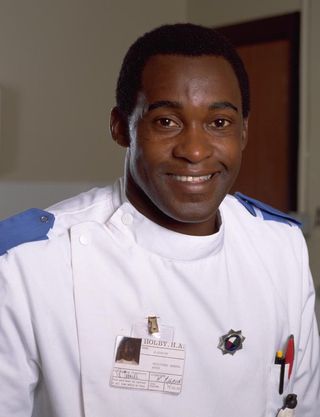 Nurse Ash (Patrick Robinson) when he first appeared in Casualty