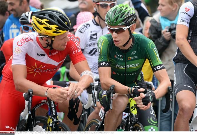 Adrien Petit (Cofidis) has a chat with Pierre Rolland (Europcar) on the startline in G&eacute;rardmer