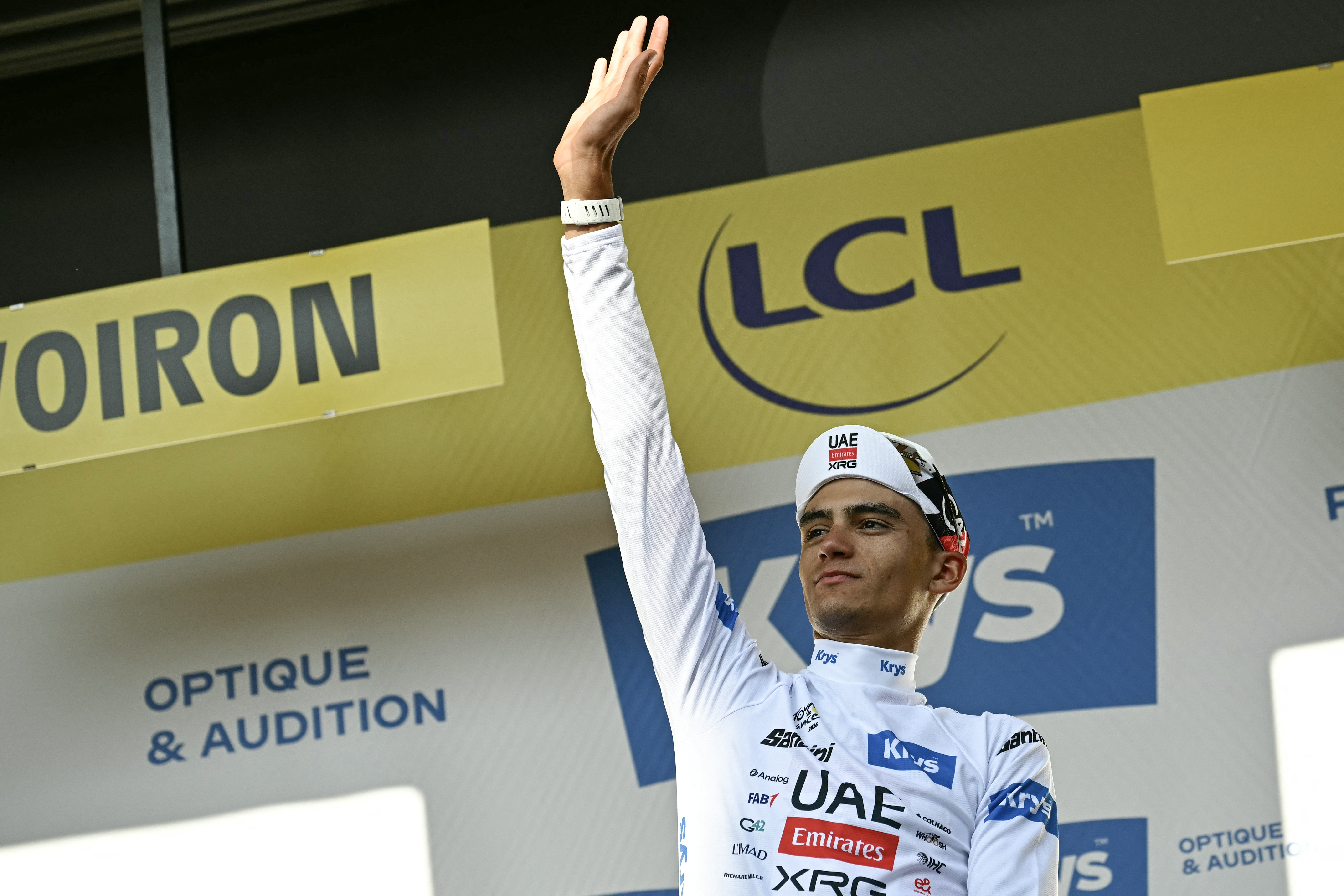 UAE Team Emirates's Mexican rider Isaac Del Toro Romero celebrates on the podium with the best young rider's white jersey after the 17th stage of the 113th edition of the Tour de France cycling race, 174,7 km between Chamb&amp;eacute;ry and Voiron in the French Alps, on July 22, 2026. (Photo by Loic VENANCE / AFP via Getty Images)