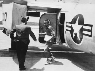 On May 5, 1961 Astronaut Alan B. Shepard Jr. arrives at Grand Bahamas Island and is greeted by astronaut Virgil I. (Gus) Grissom after the first American suborbital flight.