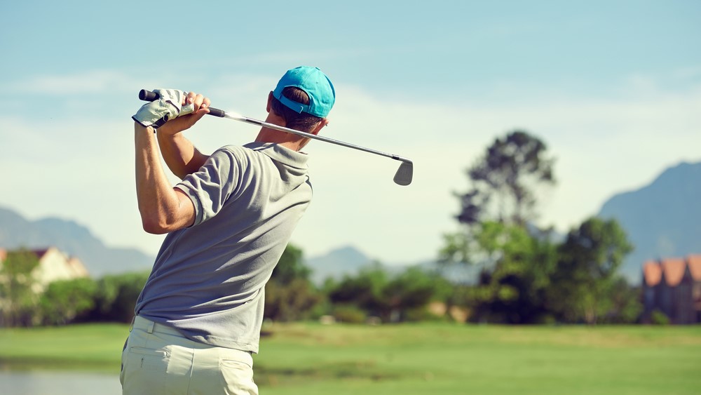 photo of a man playing golf