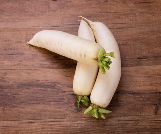 Daikon radish on a wooden background