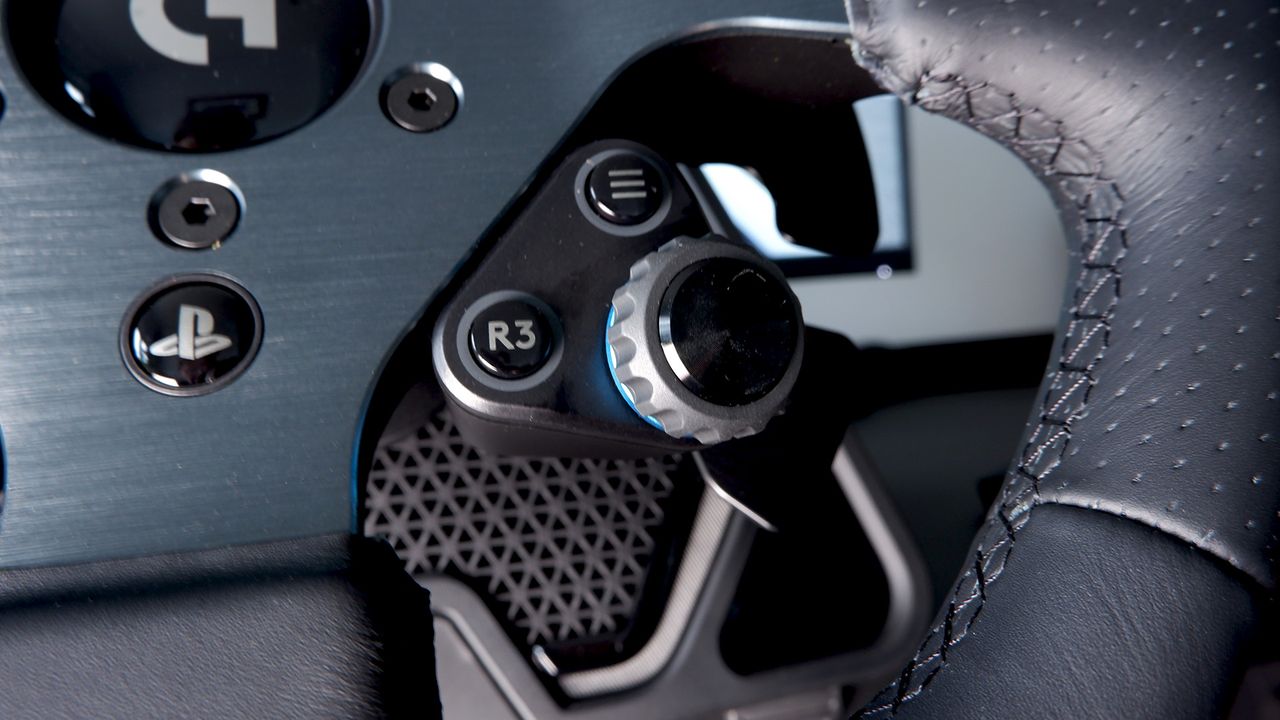 Logitech G Pro Racing Wheel and Pedals installed on a computer desk