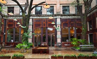 Exterior view of hotel with tables and chairs outside