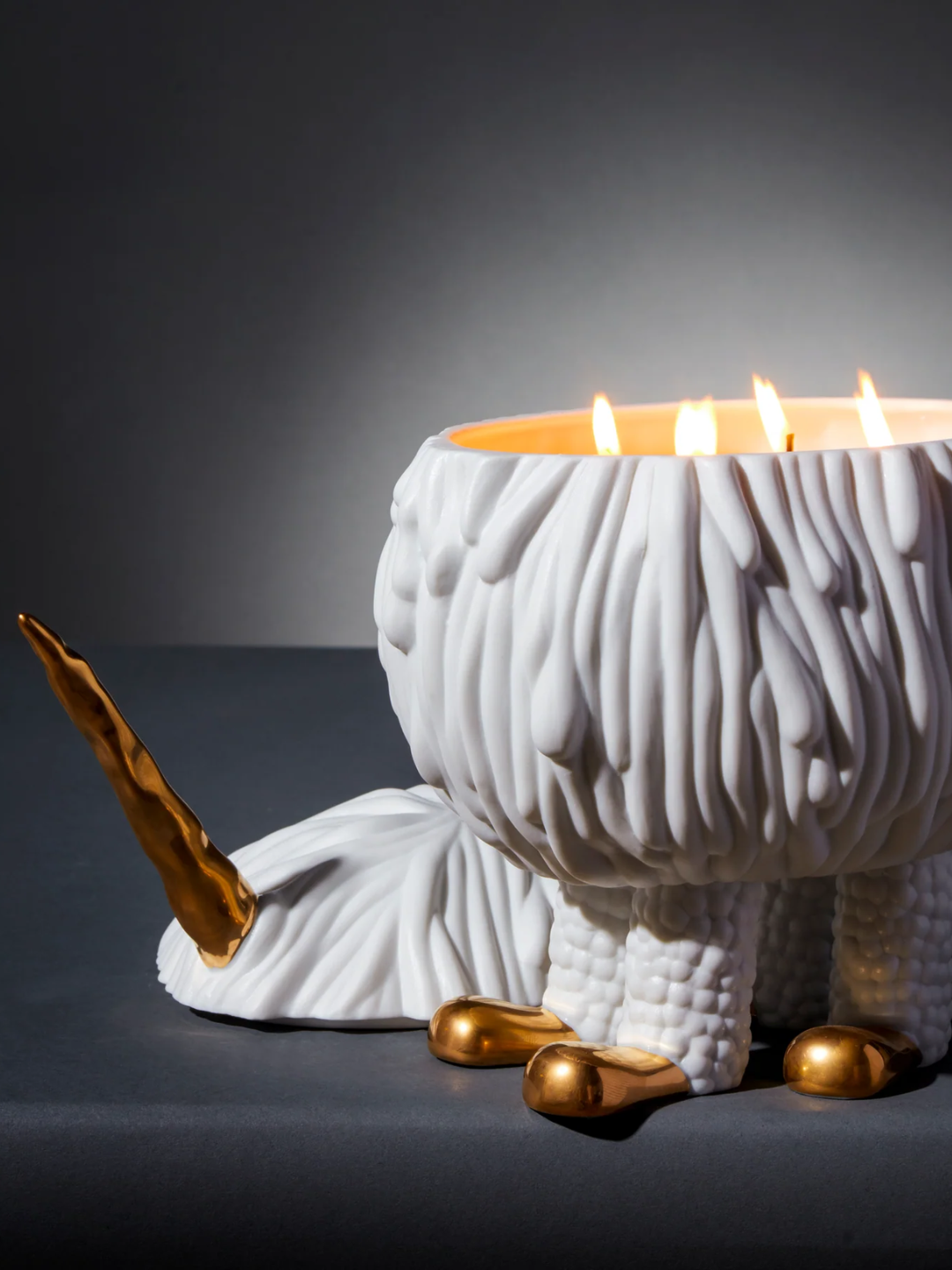 A textured scented candle shaped like an animated unicorn from L'Objet