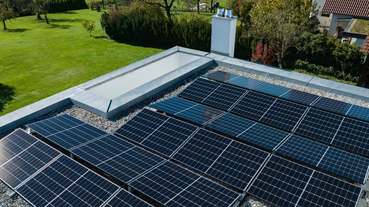 solar panels on frame on flat roof viewed from above