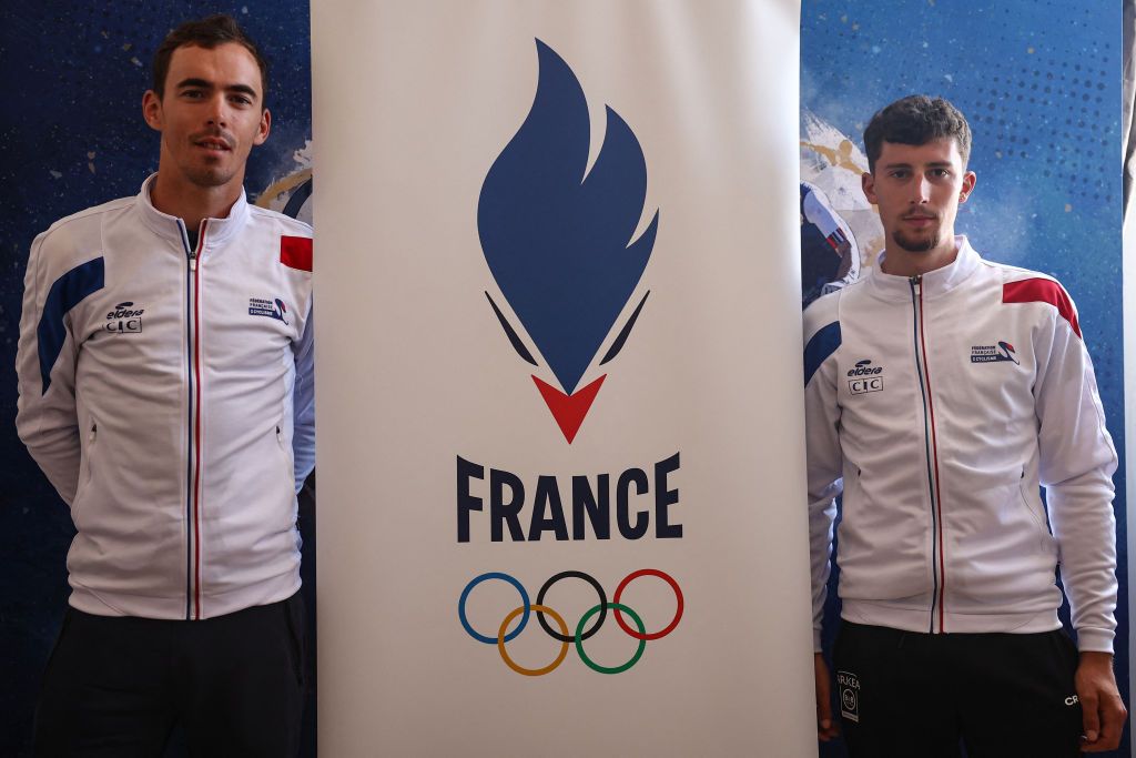 France&#039;s rider Christophe Laporte (L) and France&#039;s rider Kevin Vauquelin pose at the end of a press conference to announce their selection for the Paris 2024 Olympic Games in road cycling with France&#039;s riders Julian Alaphilippe and Valentin Madouas, in Orleans, on July 8, 2024. (Photo by Anne-Christine POUJOULAT / AFP)