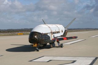 A U.S. Air Force X-37B space plane is seen on a runway at the Vandenberg Air Force Base in California in this taxi test image from June 2009.