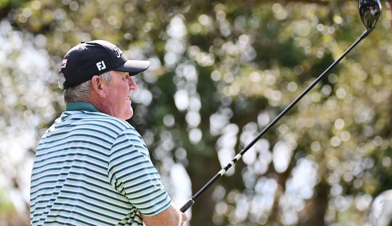 Mark Calcavecchia hits a driver and watches it in the air