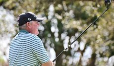 Mark Calcavecchia hits a driver and watches it in the air