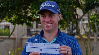 Justin Thomas with his scorecard after the second round of The Players Championship