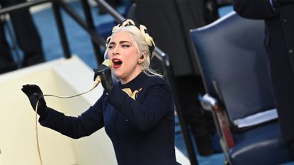 TOPSHOT - US Singer Lady Gaga sings the US National Anthem at the beginning of the swearing in ceremony of the 46th US President on January 20, 2021, at the US Capitol in Washington, DC. (Photo by SAUL LOEB / POOL / AFP) (Photo by SAUL LOEB/POOL/AFP via Getty Images)