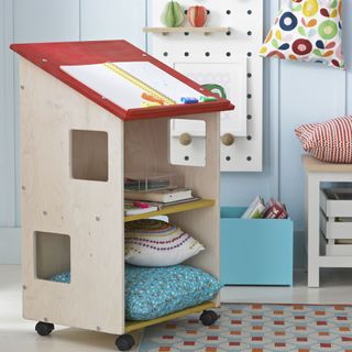 kids storage area with table for writing and storing