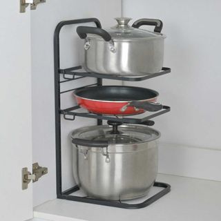 Kitchen cupboard with stacked pan storage